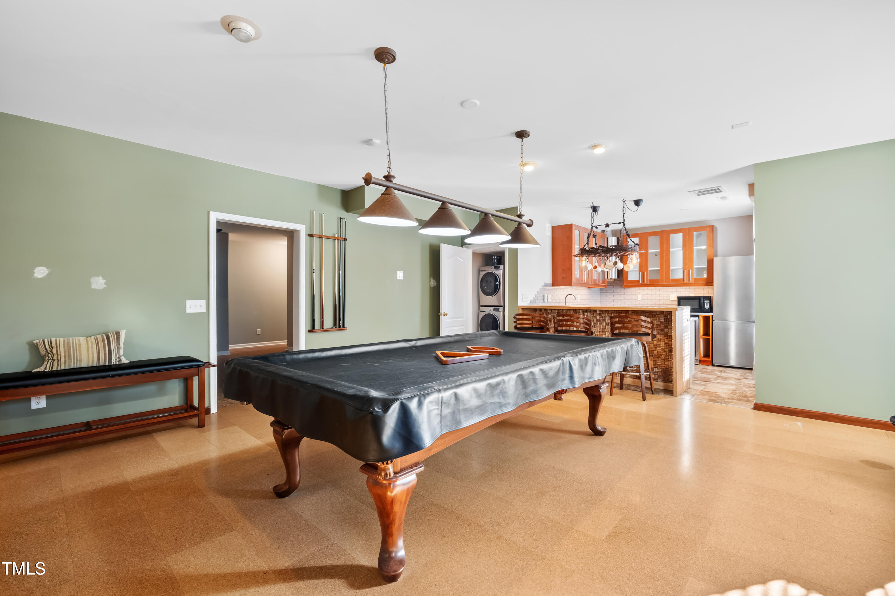 7772 Silver View Lane Raleigh, NC 27613 - Photo 32 of 55 a living room with pool table and a wooden floor