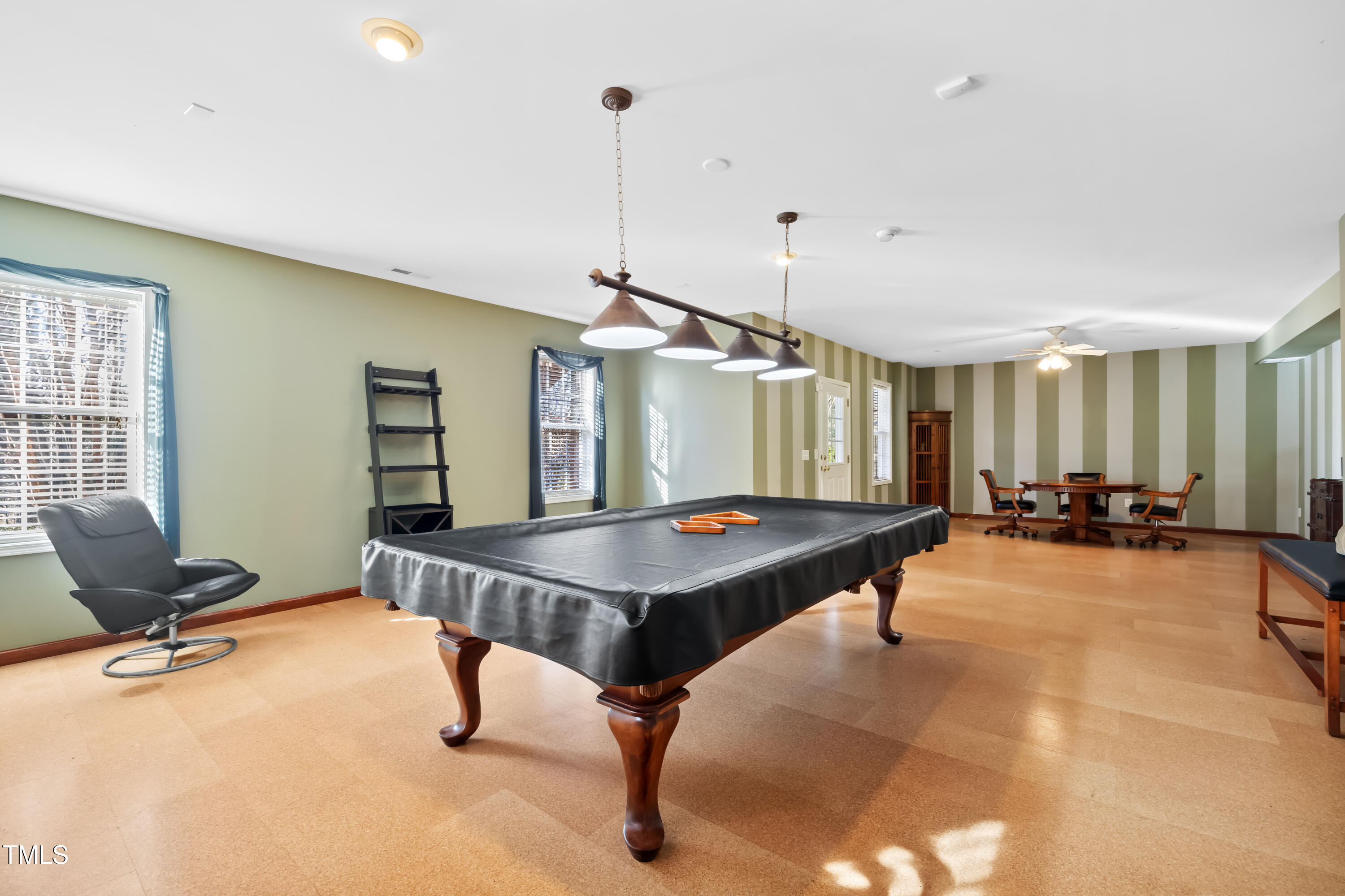 7772 Silver View Lane Raleigh, NC 27613 - Photo 33 of 55 a living room with furniture pool table and a window