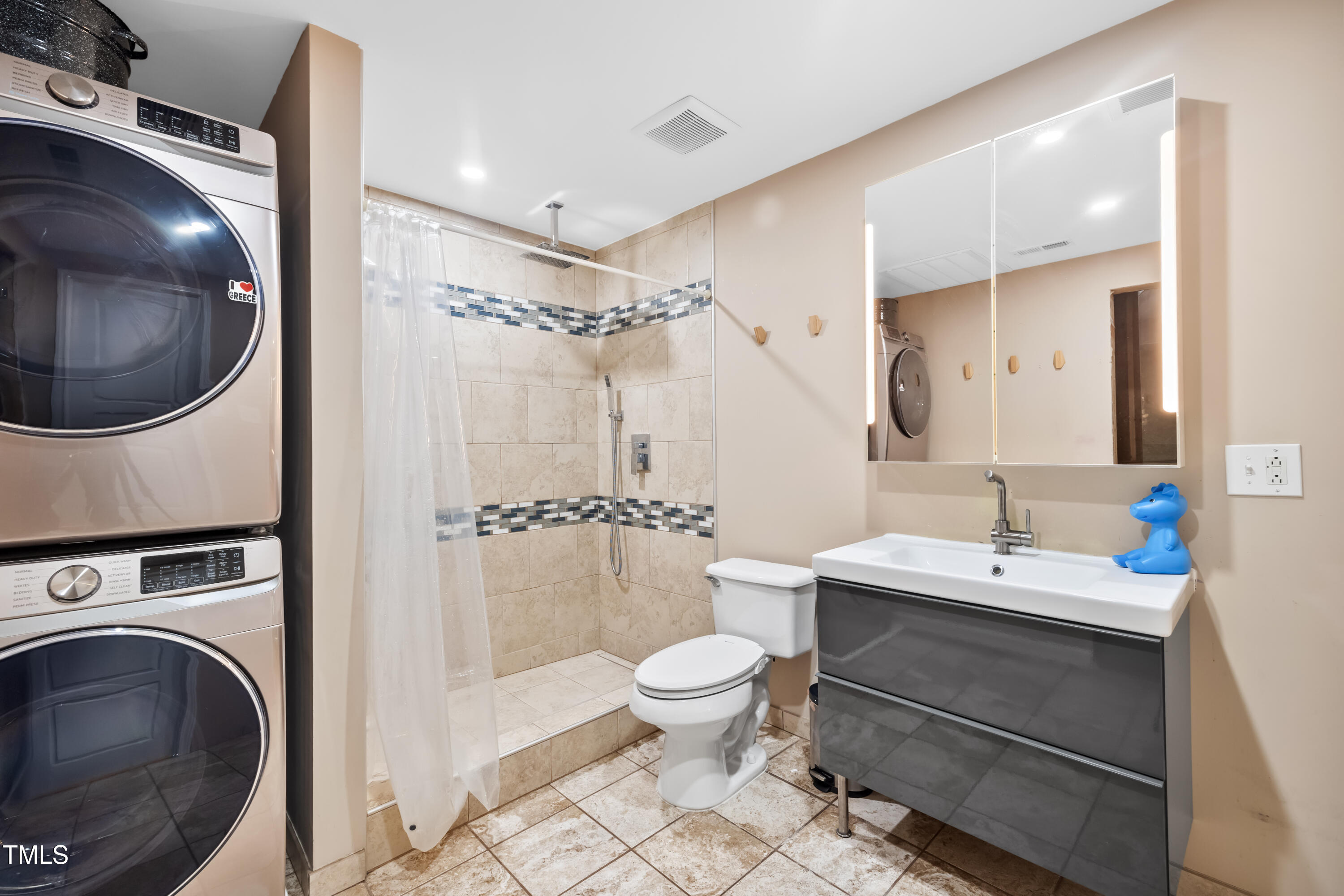 7772 Silver View Lane Raleigh, NC 27613 - Photo 36 of 55 a bathroom with a sink a toilet and a mirror
