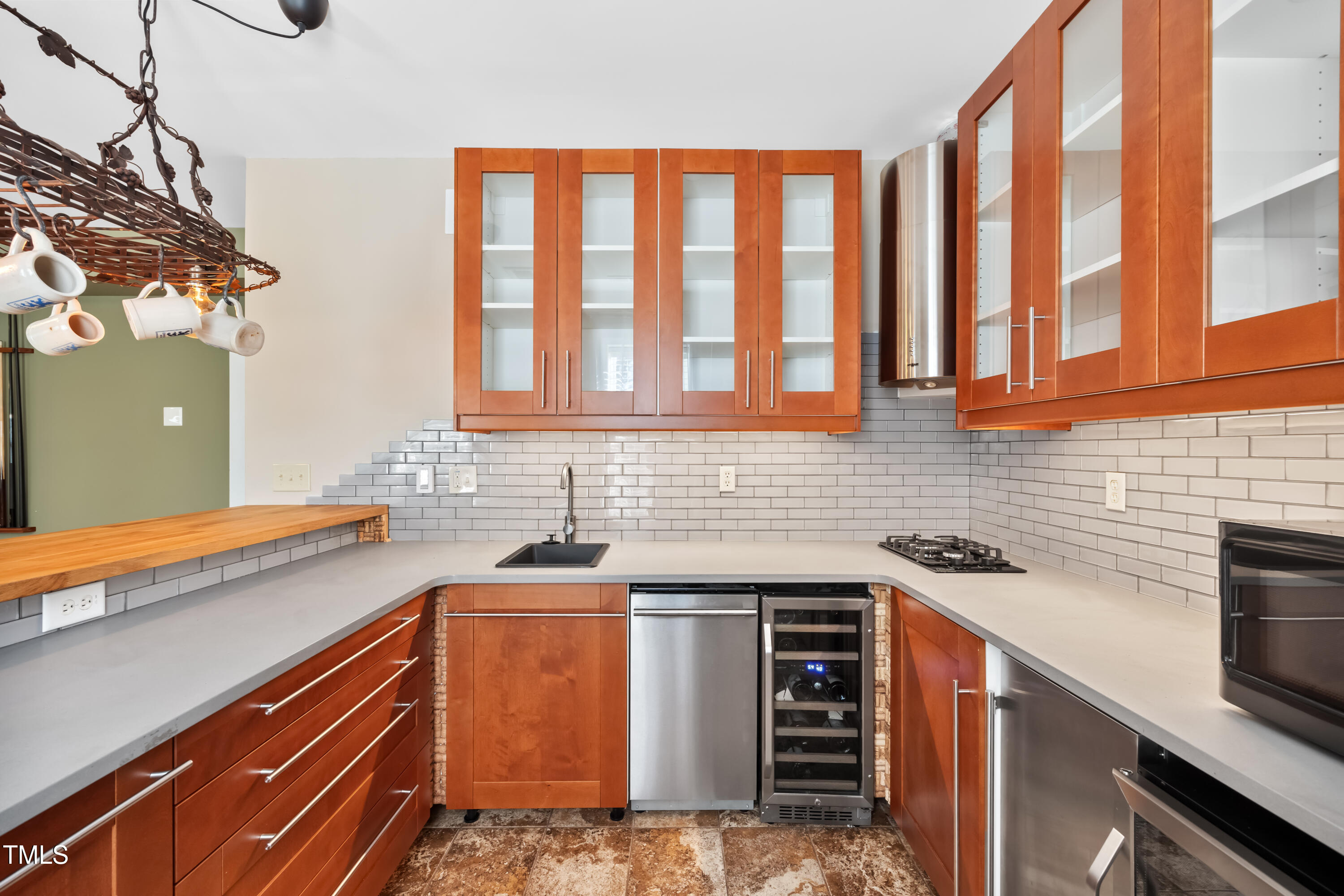 7772 Silver View Lane Raleigh, NC 27613 - Photo 39 of 55 a kitchen that has a sink and a stove