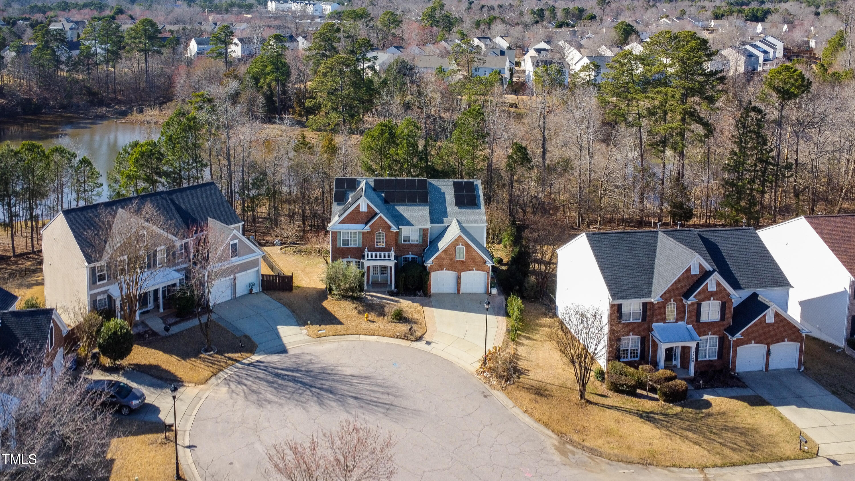 7772 Silver View Lane Raleigh, NC 27613 - Photo 44 of 55 an aerial view of a house with swimming pool and large trees
