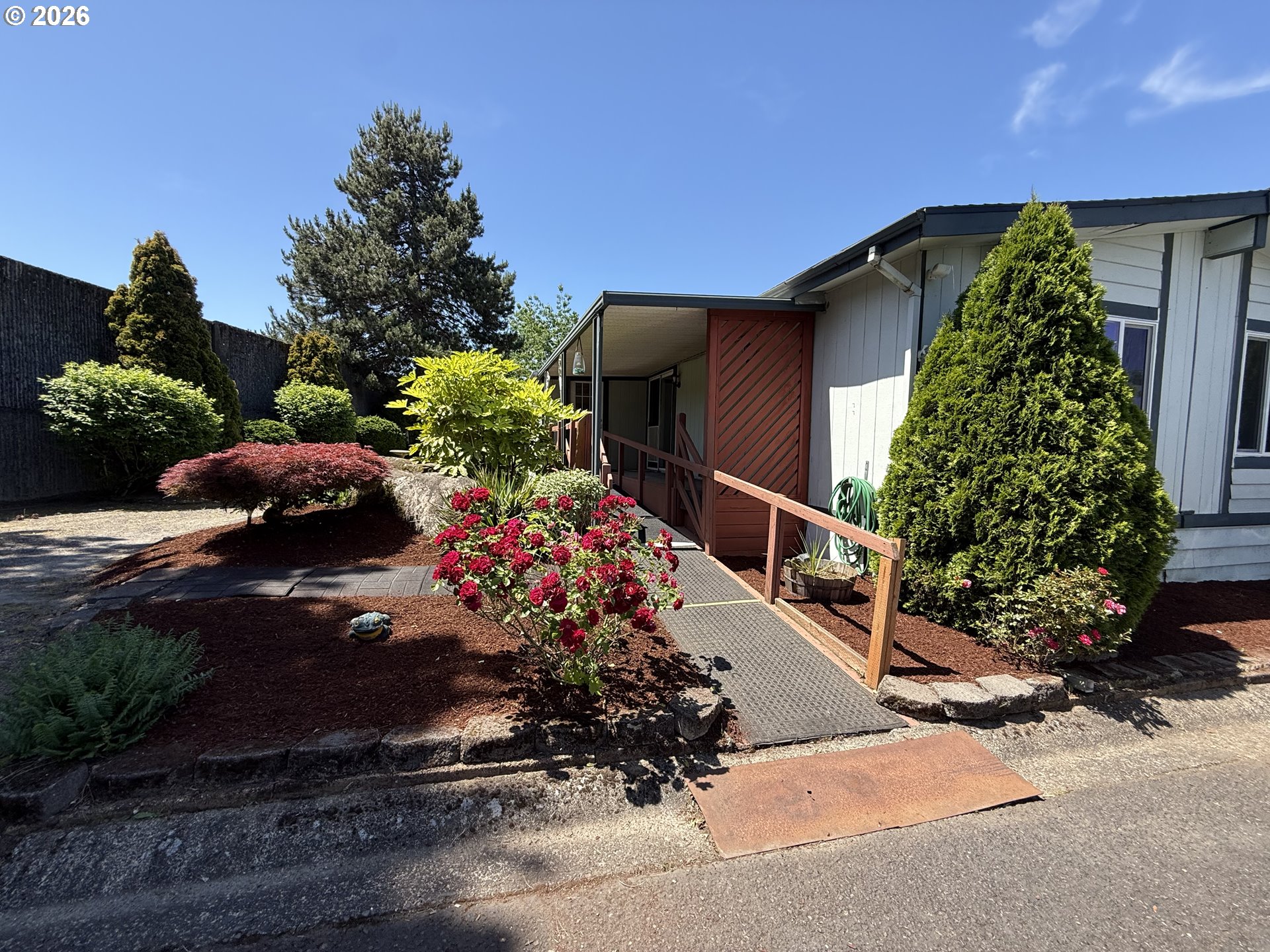 21100 Northeast Sandy Boulevard, Unit 18 Fairview, OR 97024 - Photo 37 of 37 a front view of a house with a yard