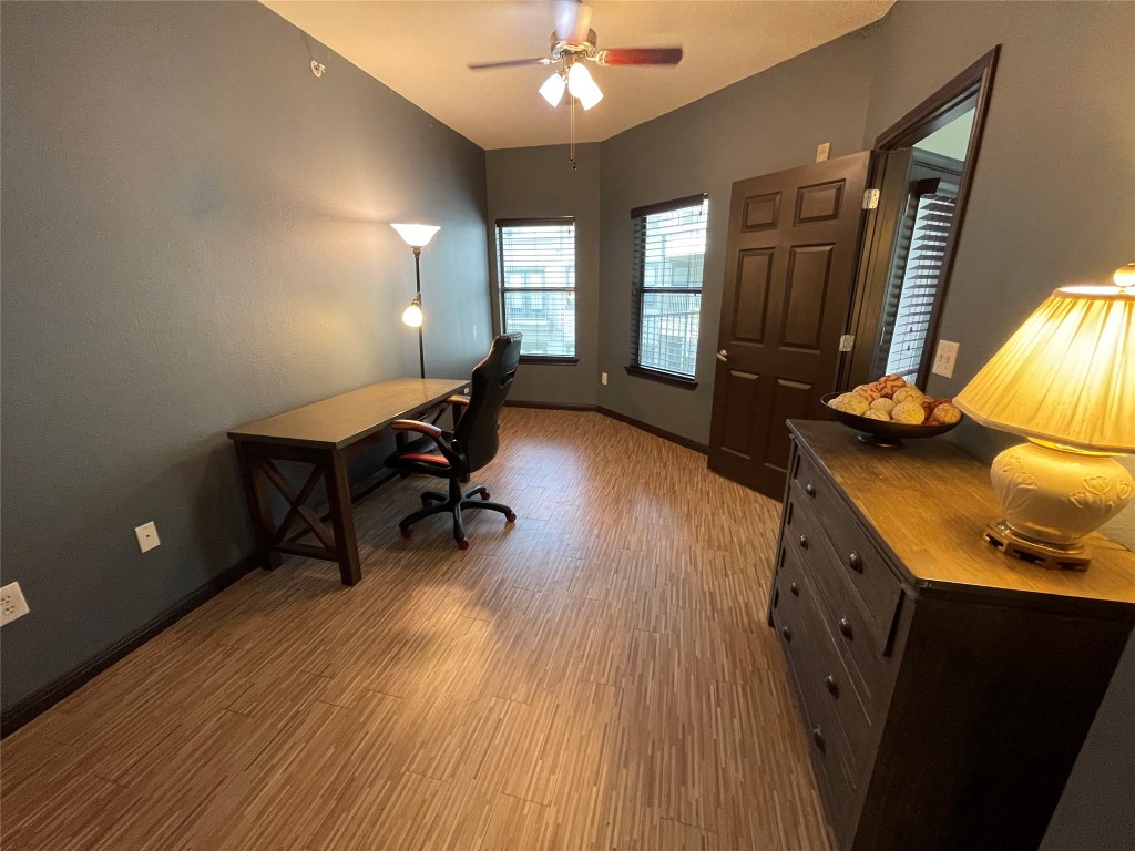 2502 Leon Street, Unit 505 Austin, TX 78705 - Photo 12 of 28 a living room with furniture and a wooden floor