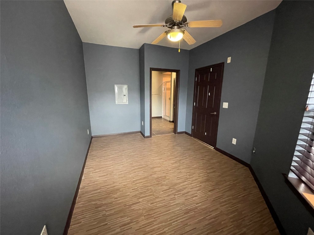 2502 Leon Street, Unit 505 Austin, TX 78705 - Photo 14 of 28 wooden floor in an empty room with a window