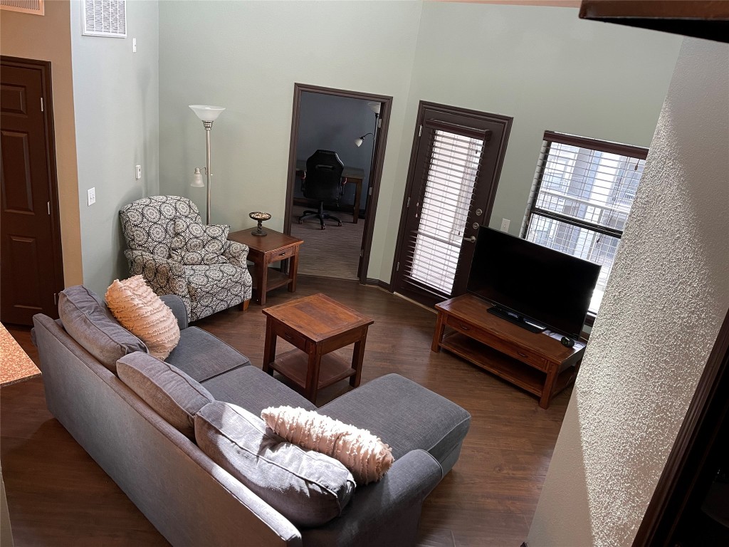 2502 Leon Street, Unit 505 Austin, TX 78705 - Photo 22 of 28 a living room with furniture and a flat screen tv