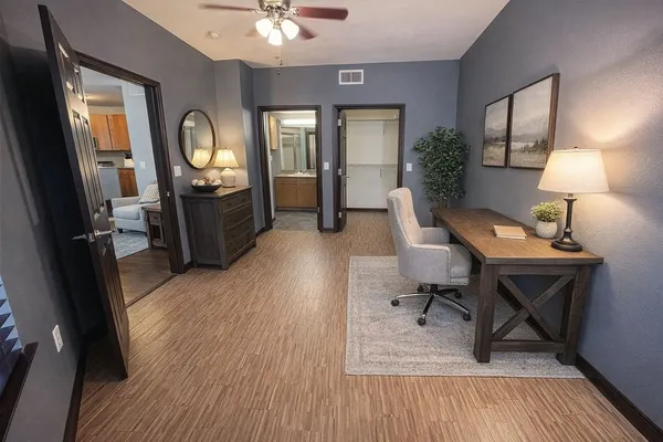 a view of a livingroom with furniture and a wooden floor