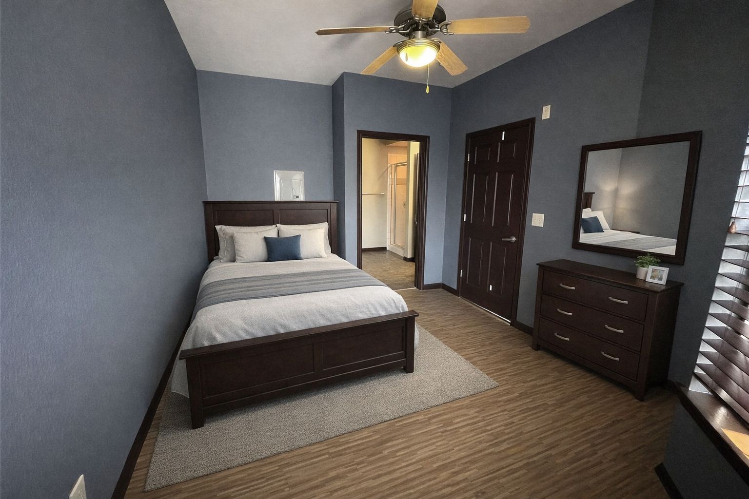 2502 Leon Street, Unit 505 Austin, TX 78705 - Photo 6 of 16 a bedroom with a bed and a flat tv screen on dresser