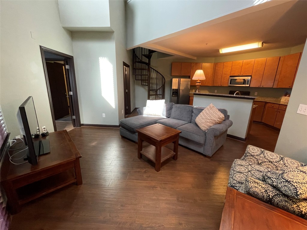 2502 Leon Street, Unit 505 Austin, TX 78705 - Photo 6 of 28 a living room with furniture and a wooden floor
