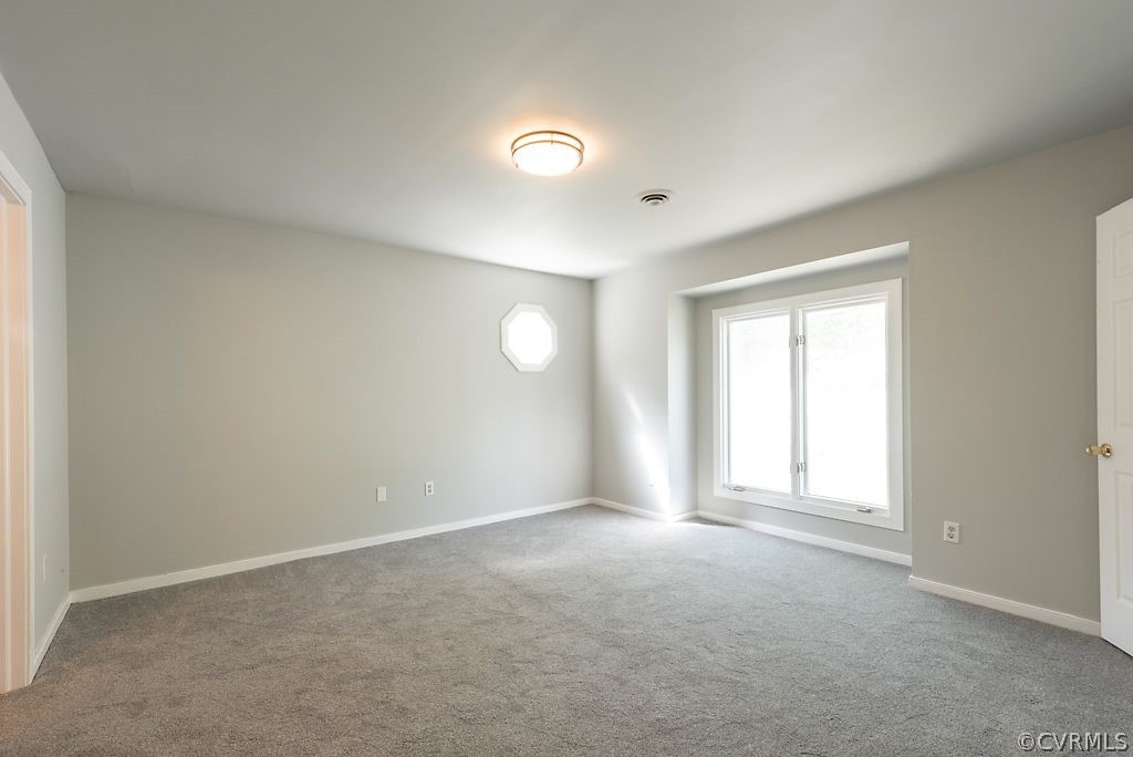 13805 Sandy Oak Road Chester, VA 23831 - Photo 20 of 28 an empty room with windows and closet