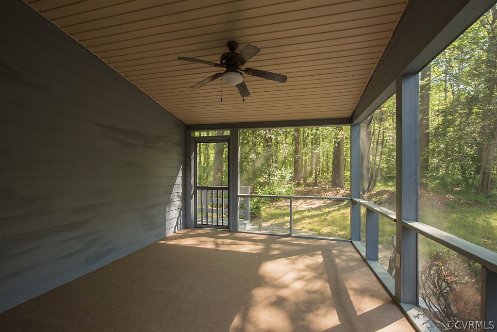 13805 Sandy Oak Road Chester, VA 23831 - Photo 6 of 28 a view of a porch with wooden floor and outdoor space