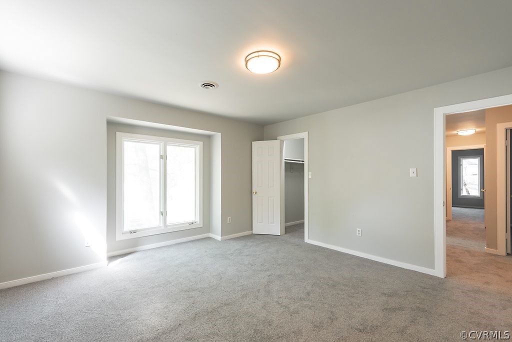 13805 Sandy Oak Road Chester, VA 23831 - Photo 8 of 28 an empty room with windows and closet