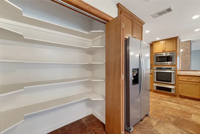 a kitchen with granite countertop a sink and a window