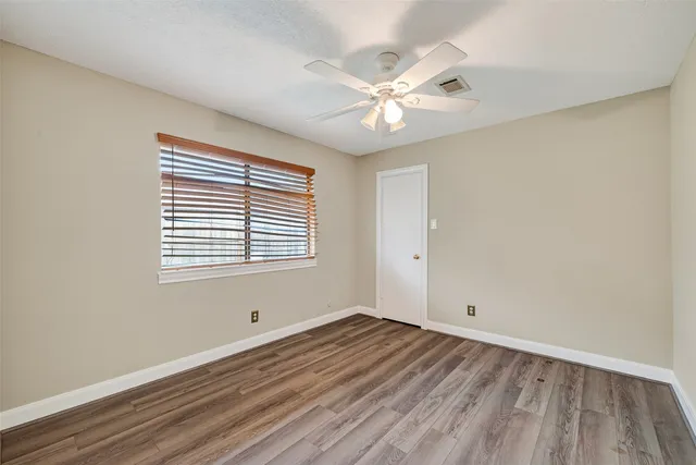 a bath tub sitting in a bathroom next to a window