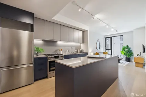 a kitchen with counter top space a sink and cabinets