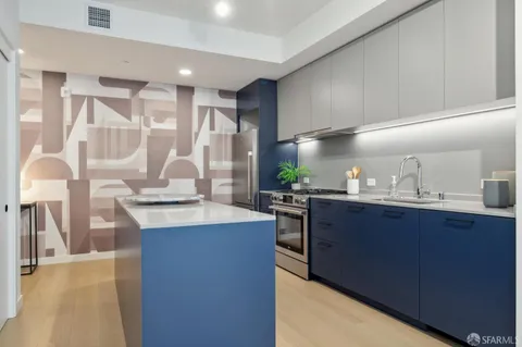 a living room with furniture a rug and a potted plant