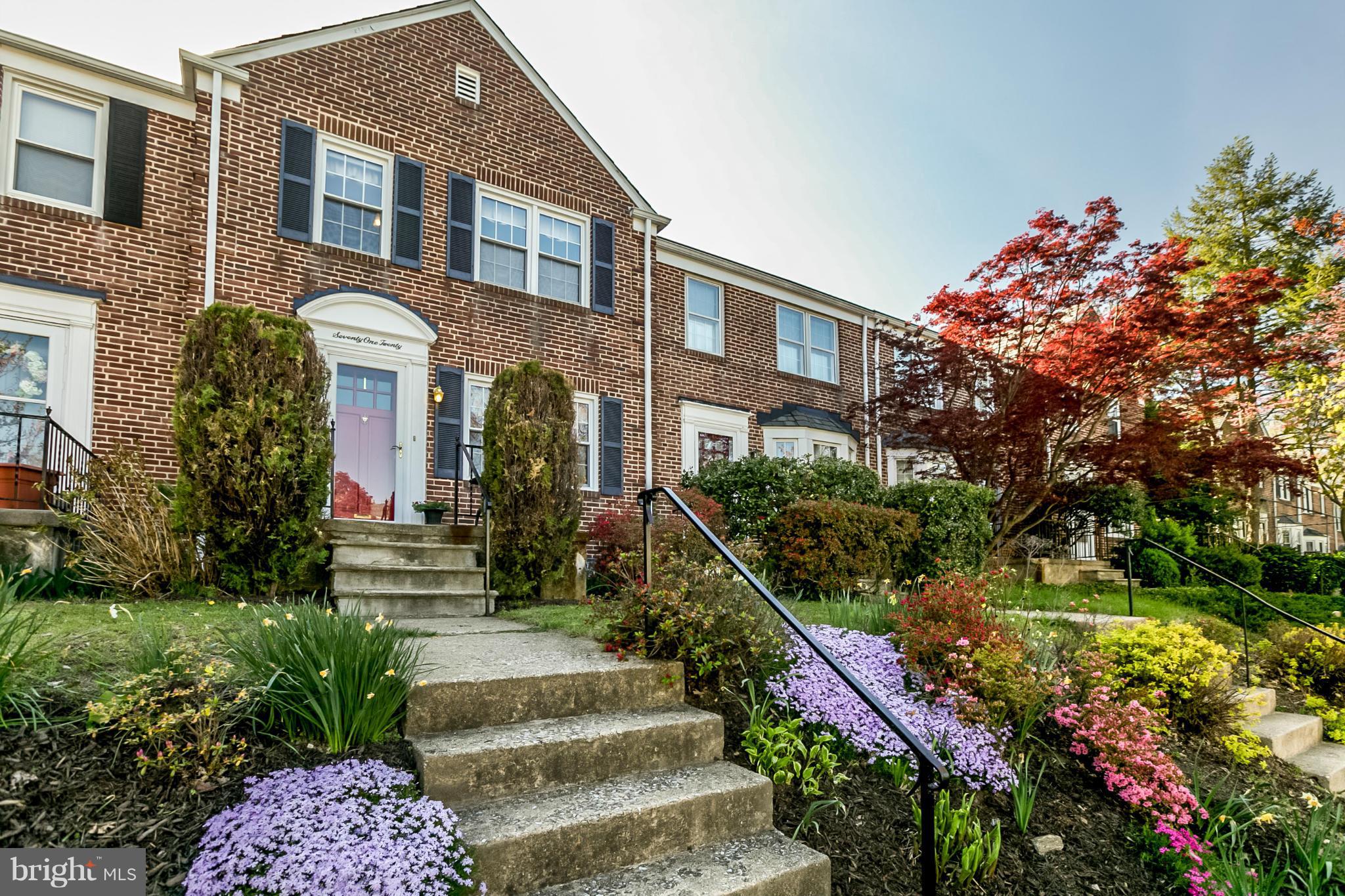 7120 Heathfield Road Baltimore, MD 21212 - Photo 1 of 29 a front view of a house with a yard and flowers