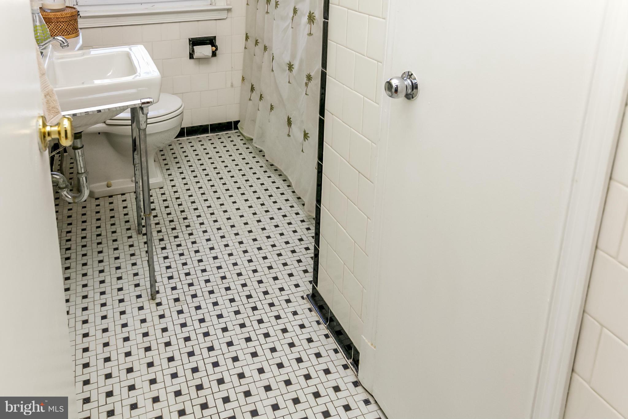 7120 Heathfield Road Baltimore, MD 21212 - Photo 16 of 29 a bathroom with a toilet and a shower