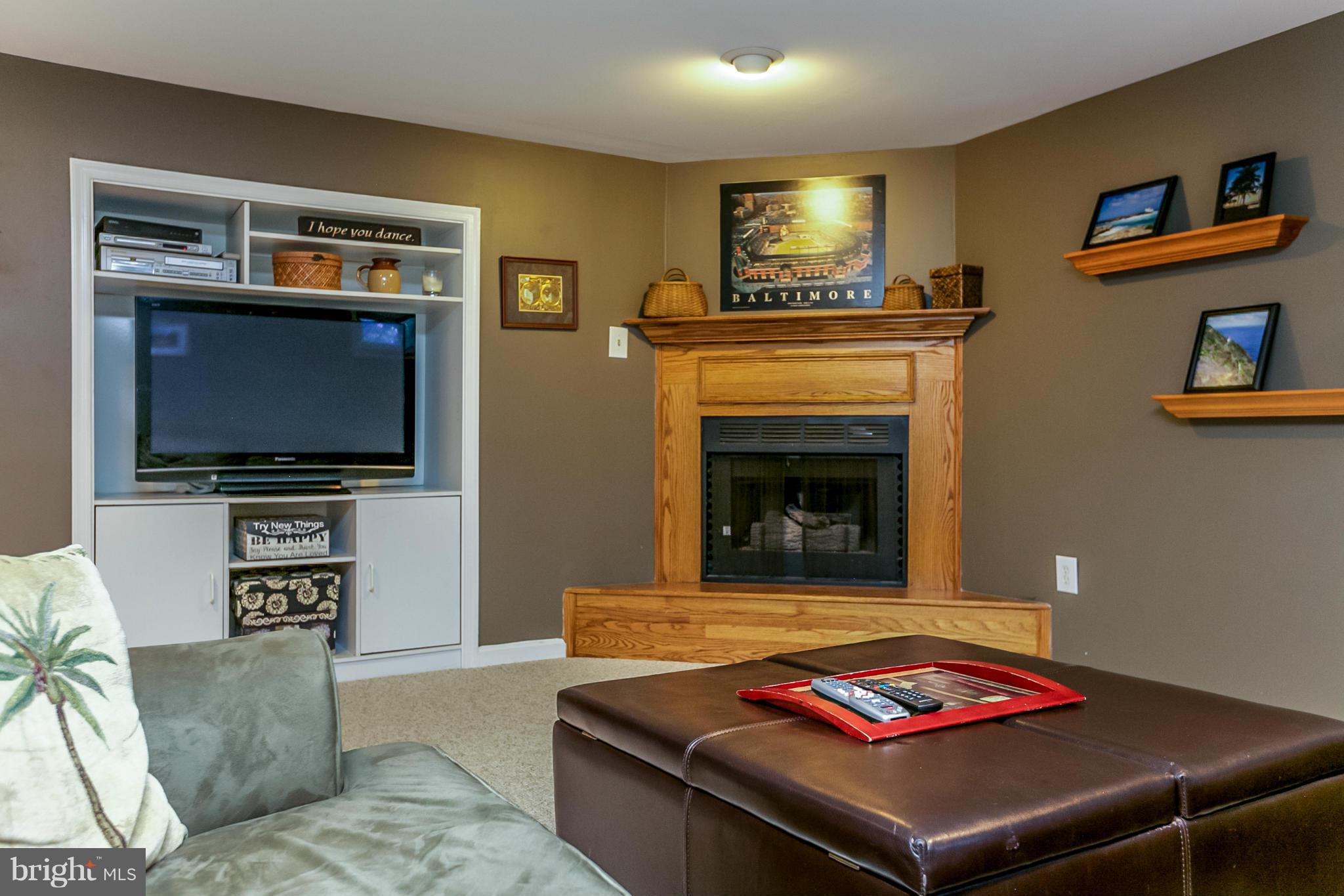 7120 Heathfield Road Baltimore, MD 21212 - Photo 25 of 29 a living room with furniture and a flat screen tv