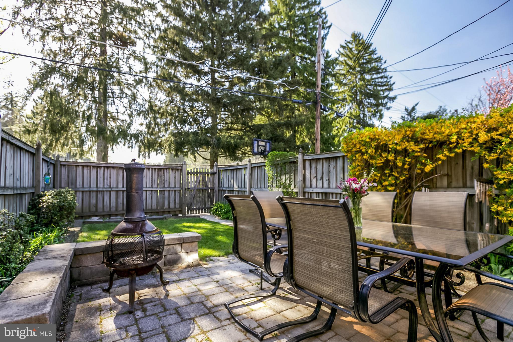7120 Heathfield Road Baltimore, MD 21212 - Photo 26 of 29 a view of a chairs and table in the back yard of the house