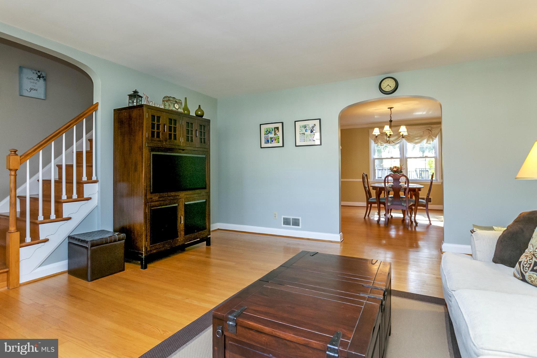 7120 Heathfield Road Baltimore, MD 21212 - Photo 6 of 29 a living room with stainless steel appliances dining room and wooden floor