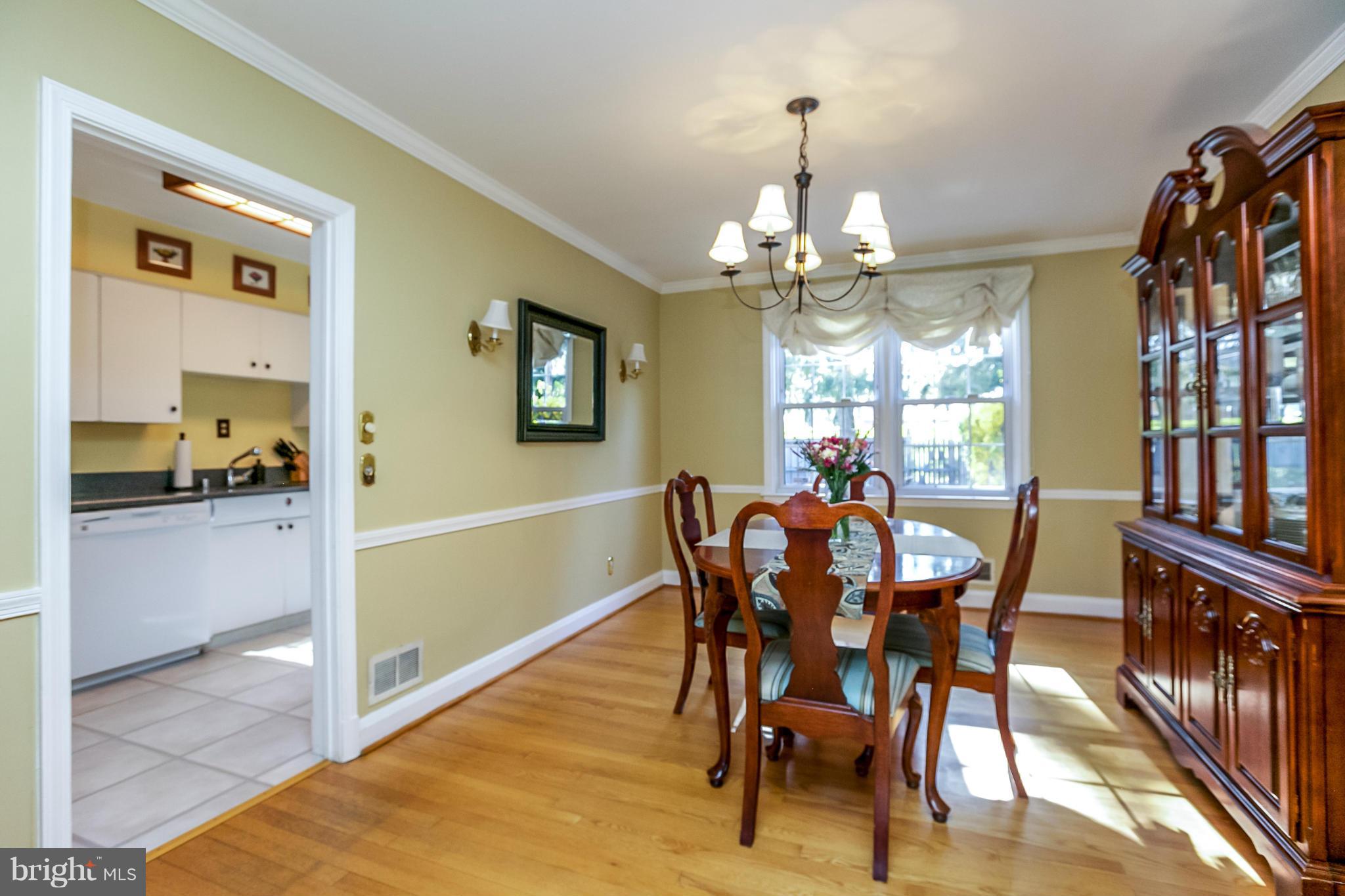 7120 Heathfield Road Baltimore, MD 21212 - Photo 7 of 29 a view of a dining room with furniture and chandelier