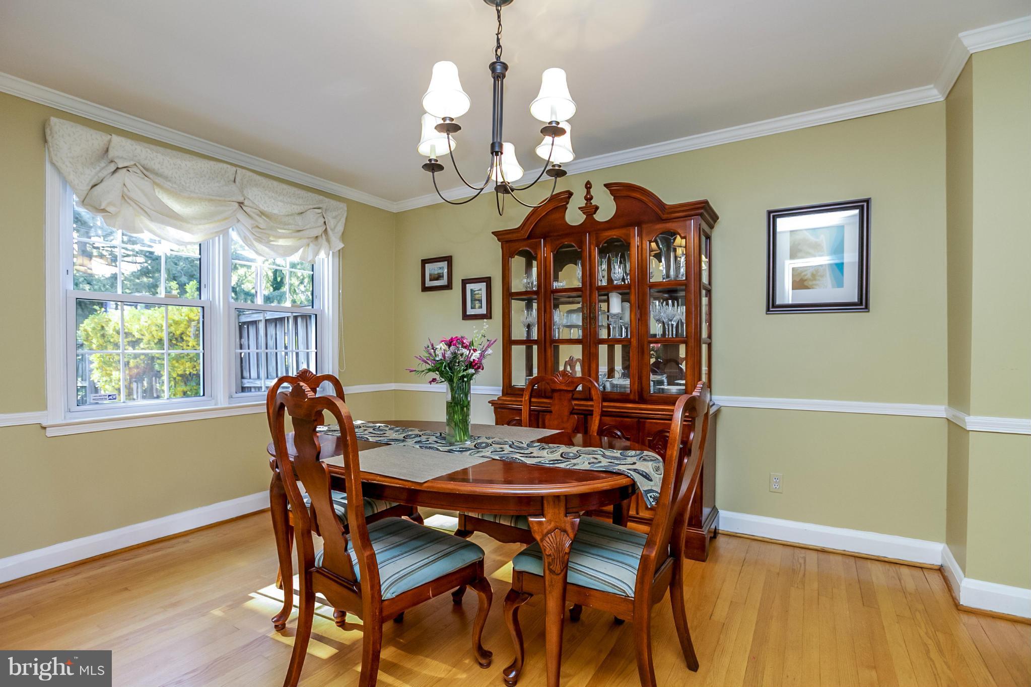 7120 Heathfield Road Baltimore, MD 21212 - Photo 8 of 29 a view of a dining room with furniture window and wooden floor