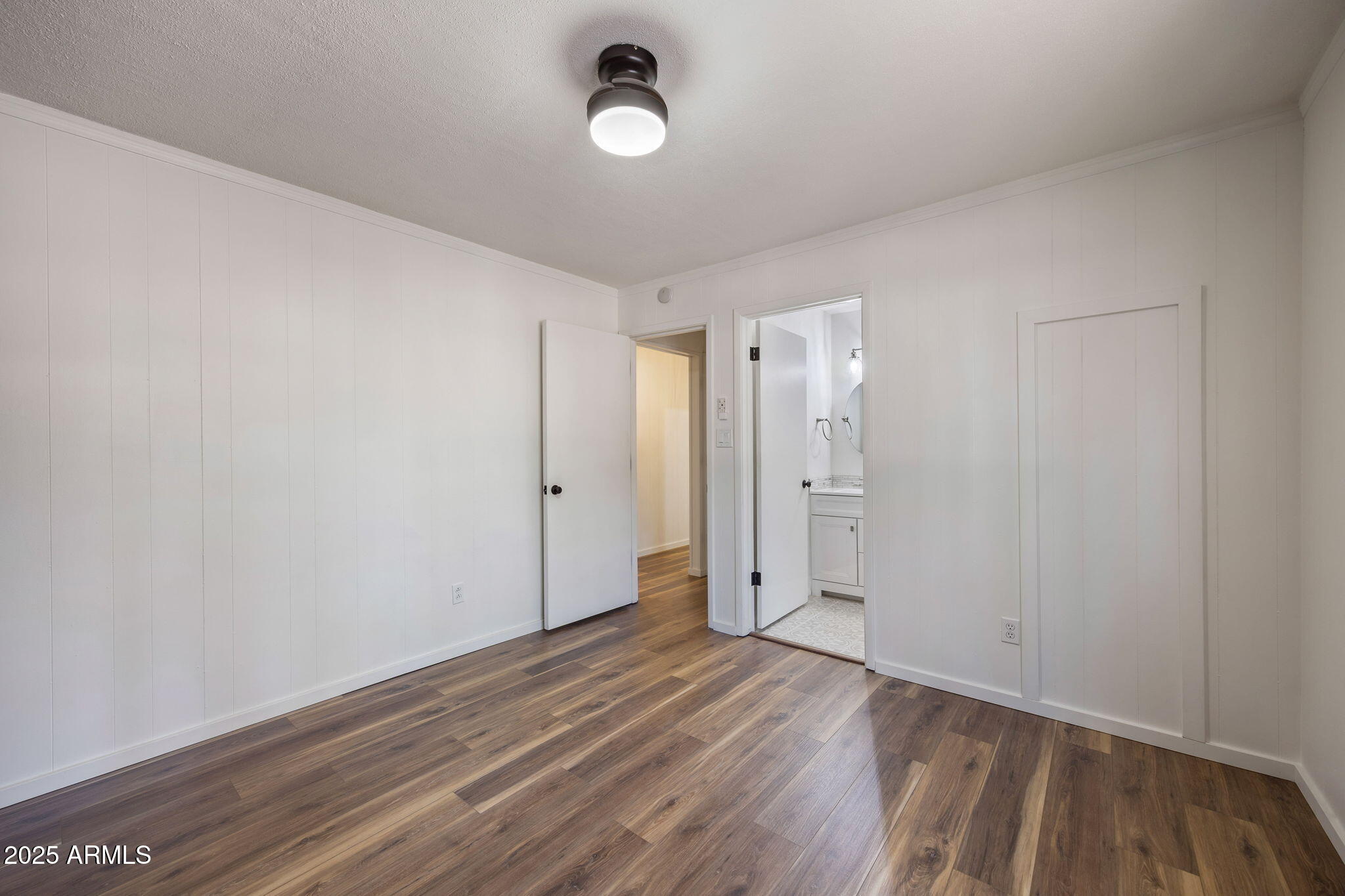 2127 Pony Road Overgaard, AZ 85933 - Photo 14 of 30 a view of an empty room and wooden floor