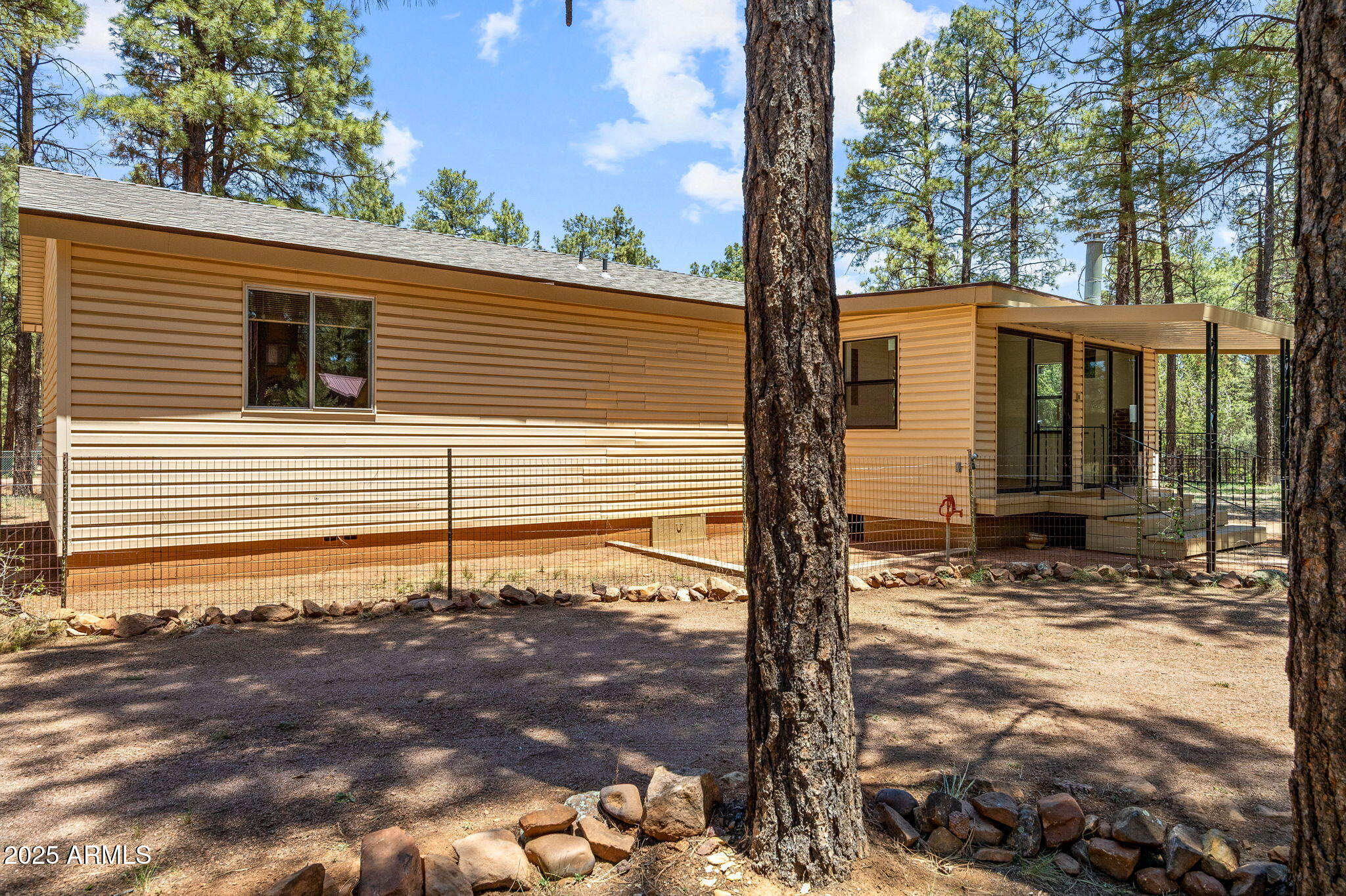 2127 Pony Road Overgaard, AZ 85933 - Photo 2 of 30 a view of a house with a yard