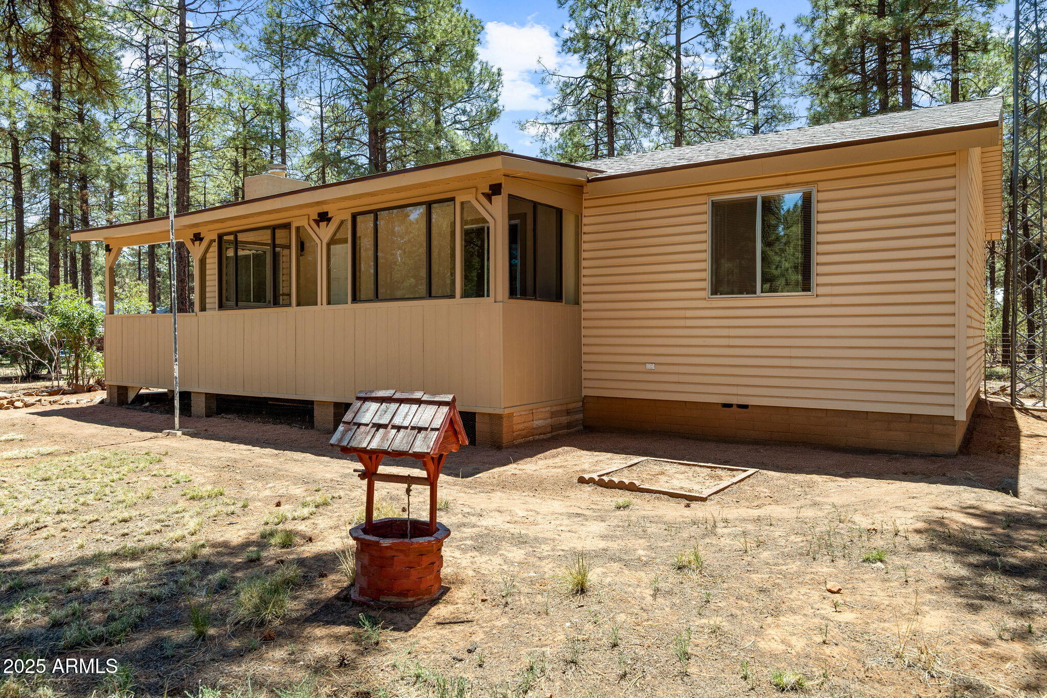 2127 Pony Road Overgaard, AZ 85933 - Photo 25 of 30 a front view of a house with a yard
