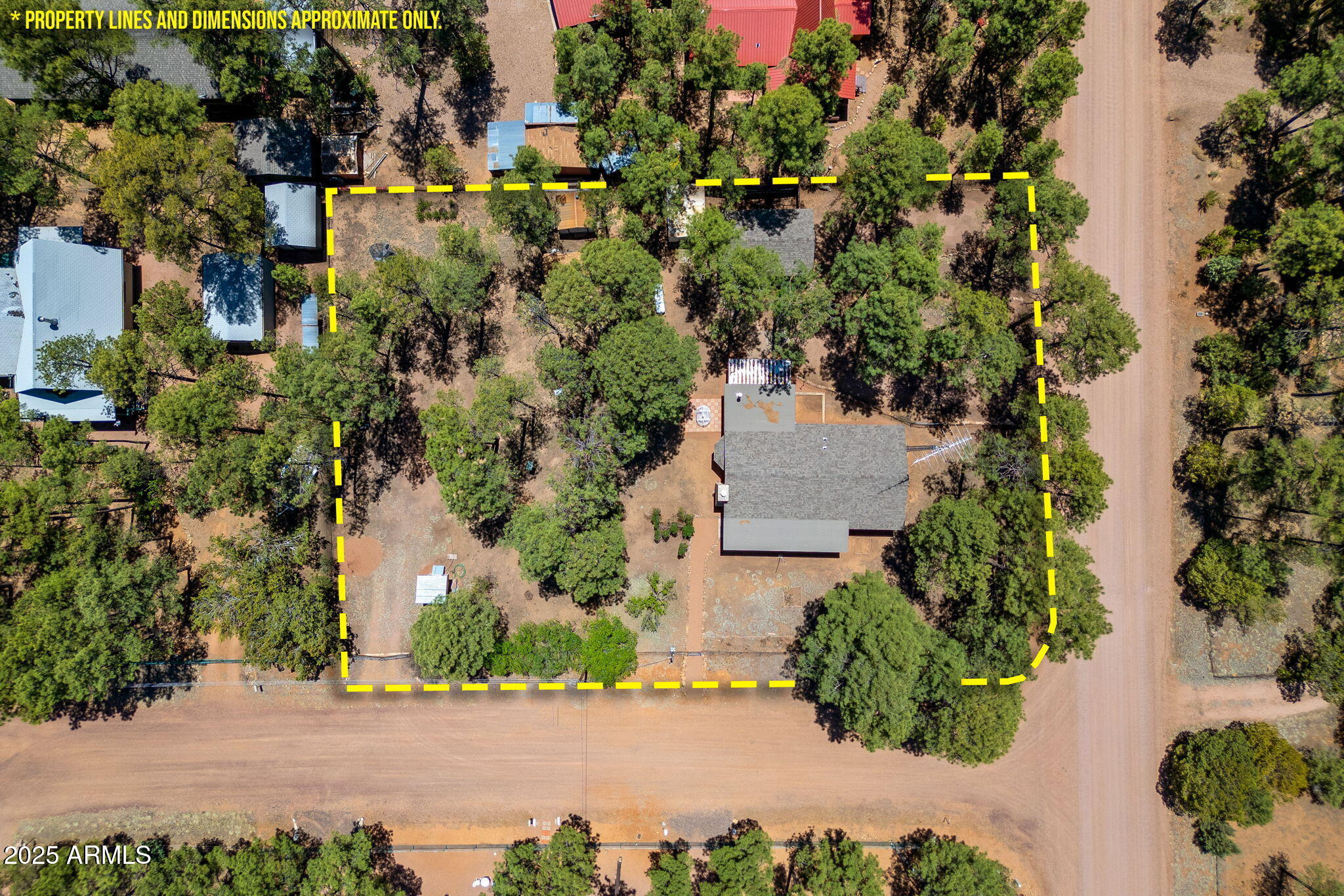 2127 Pony Road Overgaard, AZ 85933 - Photo 29 of 30 an aerial view of a house with a yard and greenery