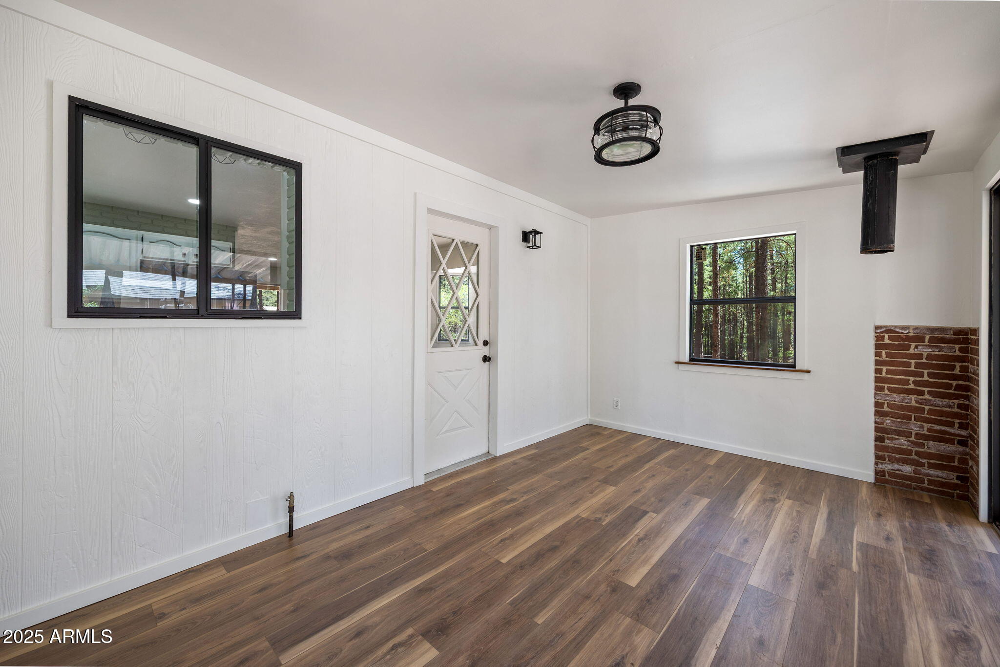 2127 Pony Road Overgaard, AZ 85933 - Photo 6 of 30 a view of empty room with wooden floor and fan