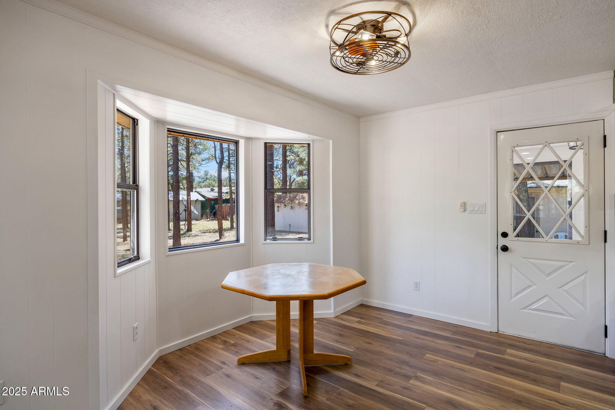 2127 Pony Road Overgaard, AZ 85933 - Photo 7 of 30 a view of a room with a table and a chandelier