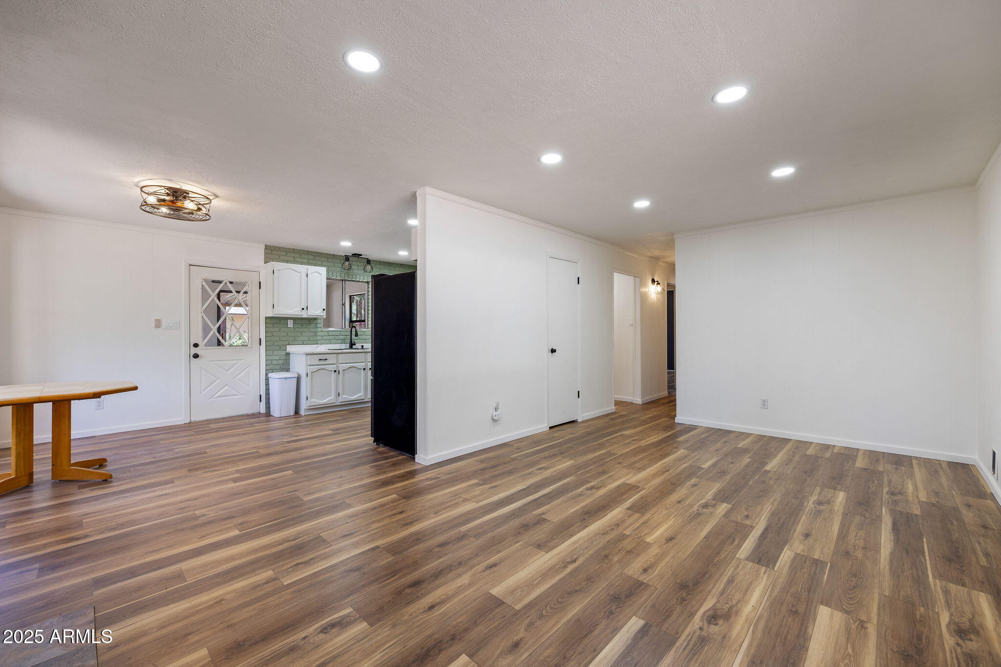 2127 Pony Road Overgaard, AZ 85933 - Photo 10 of 30 a view of empty room with wooden floor