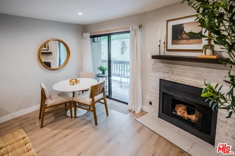 a view of a livingroom with furniture and a fireplace