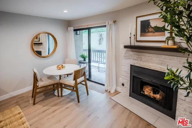 a view of a livingroom with furniture and a fireplace