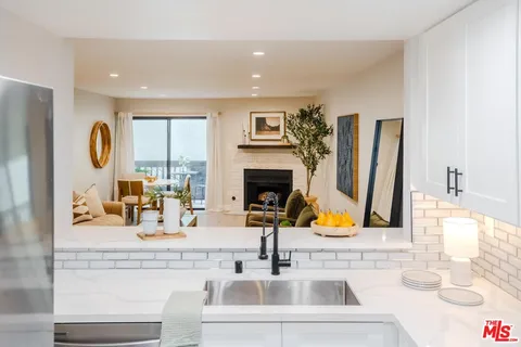 a bathroom with double vanity sink and a mirror