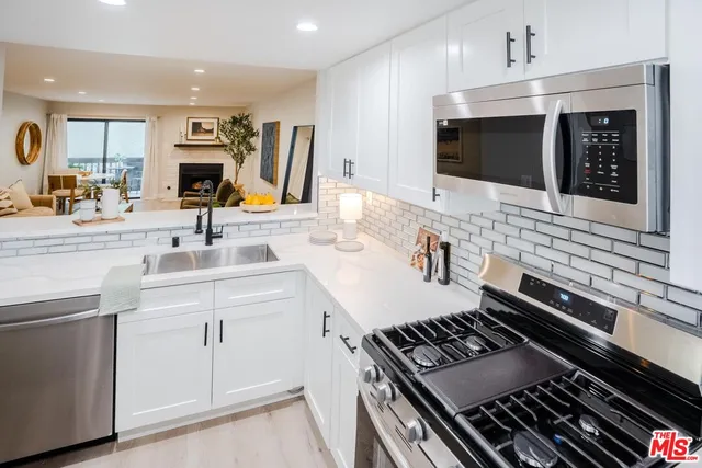 a kitchen with a stove and a microwave