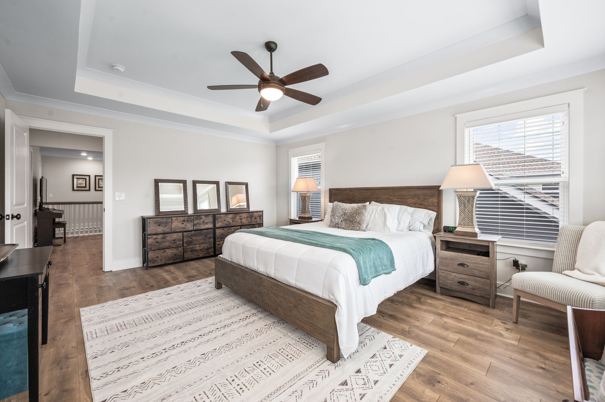 141 Foxhall Dr Spring Hill Spring Hill, TN 37174 - Photo 12 of 31 a bedroom with a large bed and a chandelier