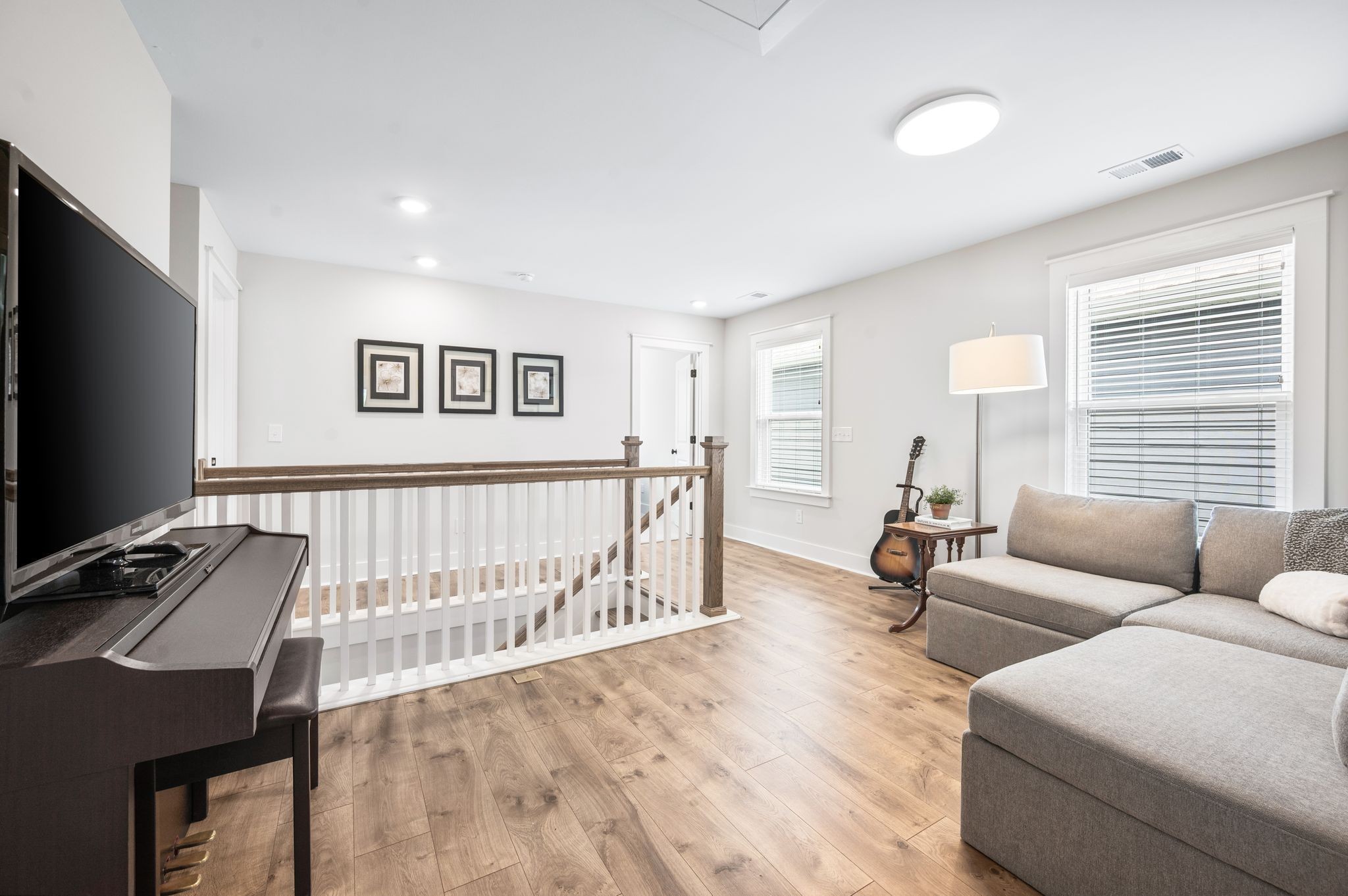141 Foxhall Dr Spring Hill Spring Hill, TN 37174 - Photo 16 of 31 a living room with furniture and a flat screen tv