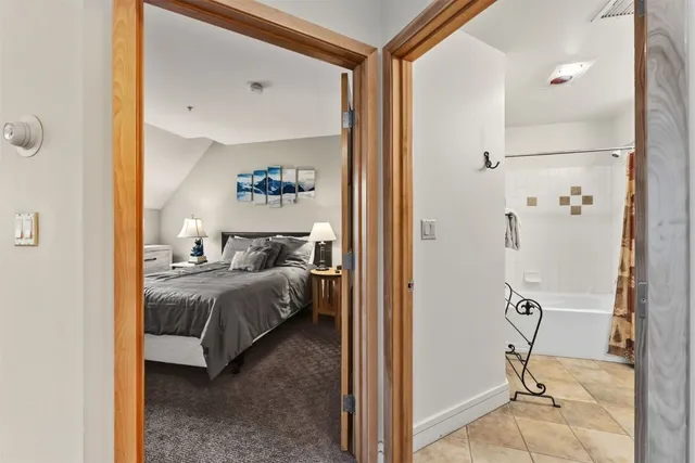 a view of bedroom with furniture and wooden floor