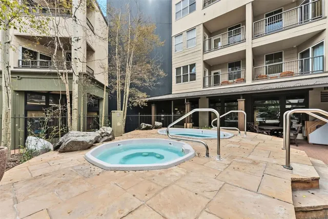 swimming pool view with a seating space