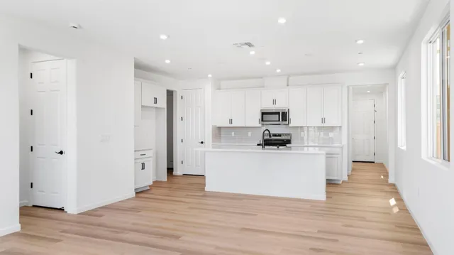 a view of kitchen with wooden floor