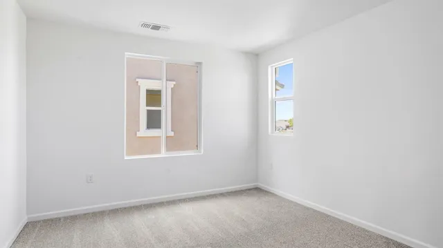an empty room with windows