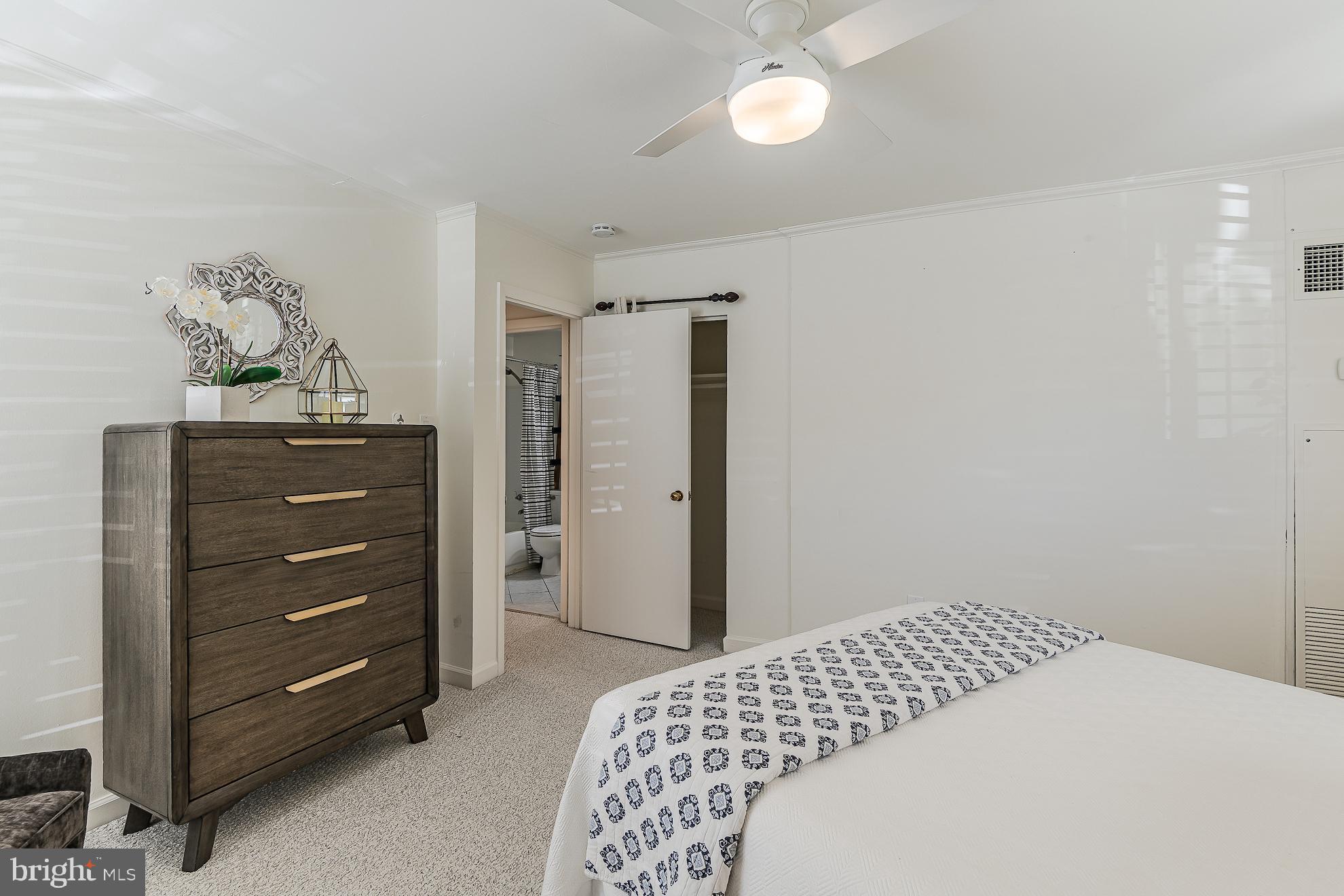 333 2nd Street Northeast, Unit 206 Washington, DC 20002 - Photo 17 of 19 a bedroom with a bed and a dresser