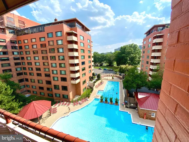 a backyard of a house with outdoor seating