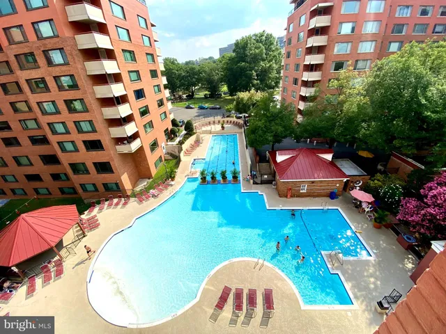 a view of swimming pool with outdoor seating