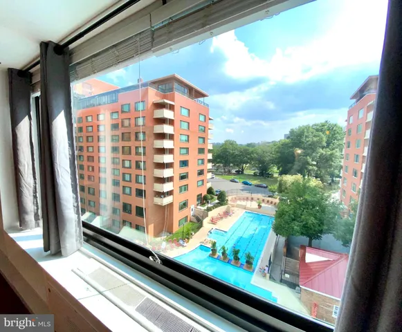 a view of a balcony with chairs