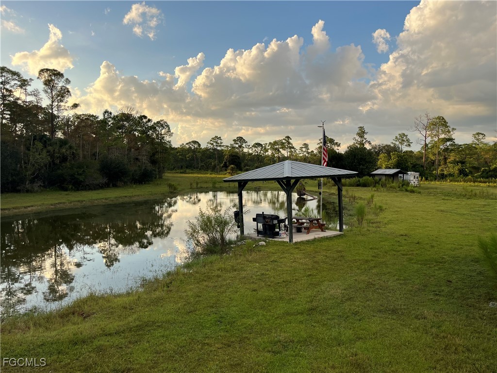 17800 Grand Chenier Road Fort Myers, FL 33913 - Photo 14 of 34 a view of a lake in front of house with outdoor seating
