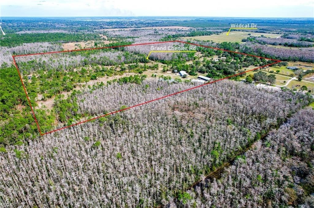 17800 Grand Chenier Road Fort Myers, FL 33913 - Photo 26 of 34 a view of a garden with a building