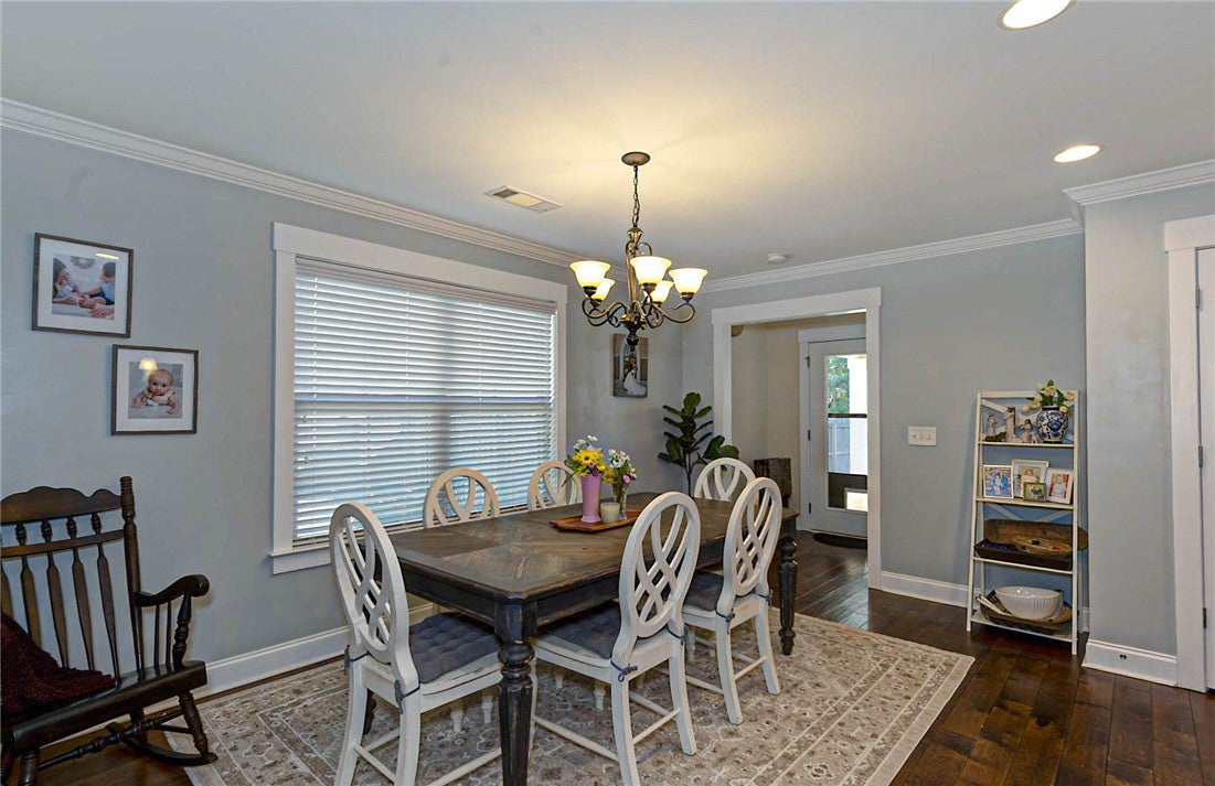 641 Deer Run Road Auburn, AL 36832 - Photo 6 of 28 This inviting dining area features crown molding and rich hardwood flooring, creating an ideal setting for gatherings.
